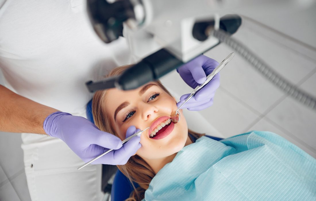 Beautiful lady in the dentist's office. Woman in a uniform