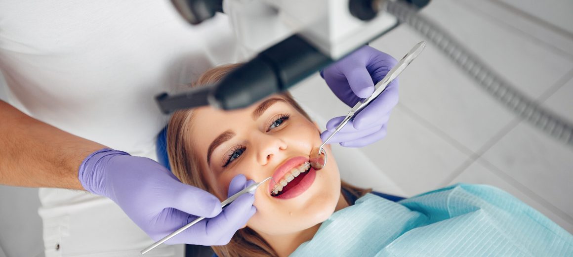 Beautiful lady in the dentist's office. Woman in a uniform
