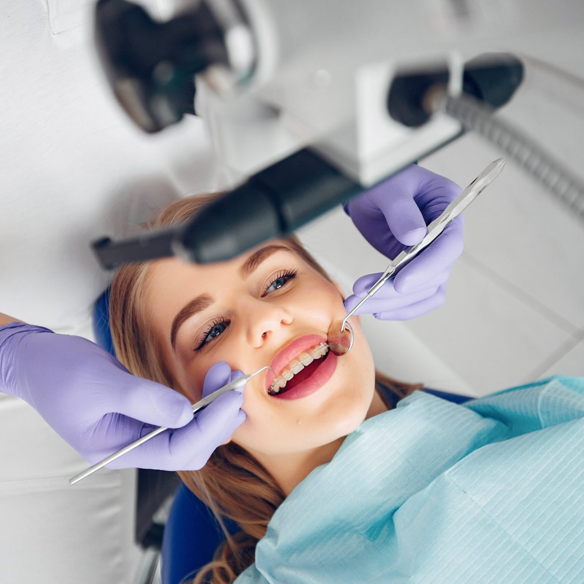 Beautiful lady in the dentist's office. Woman in a uniform