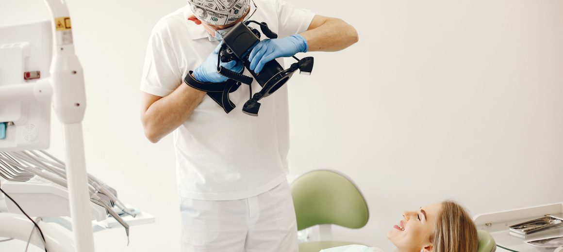 Beautiful lady in the dentist's office. Woman in a uniform