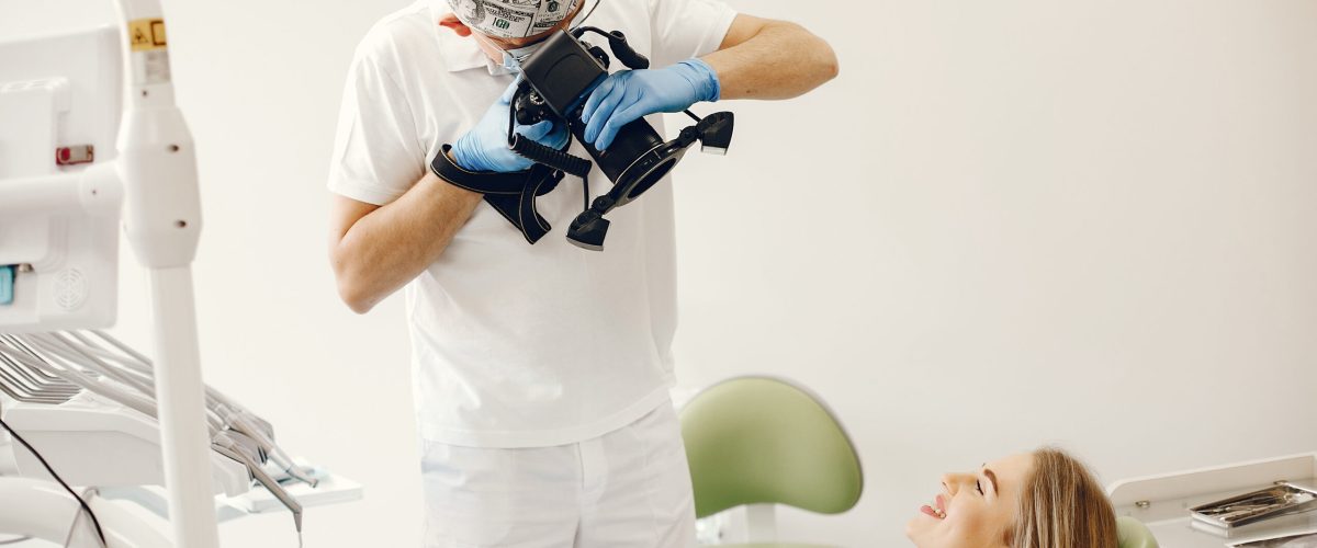 Beautiful lady in the dentist's office. Woman in a uniform