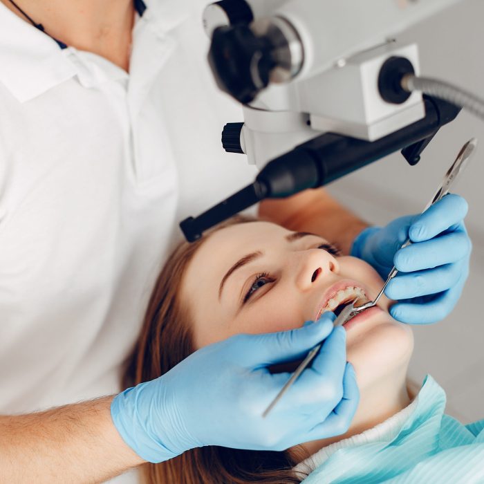 Beautiful lady in the dentist's office. Woman in a uniform