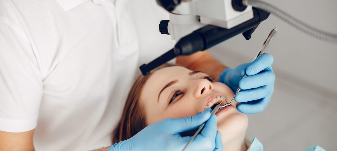Beautiful lady in the dentist's office. Woman in a uniform