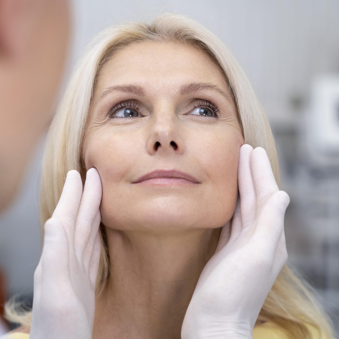 close-up-doctor-checking-smiley-woman