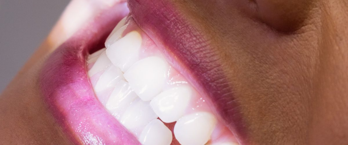 Close-up of female patient receiving a dental treatment at clinic